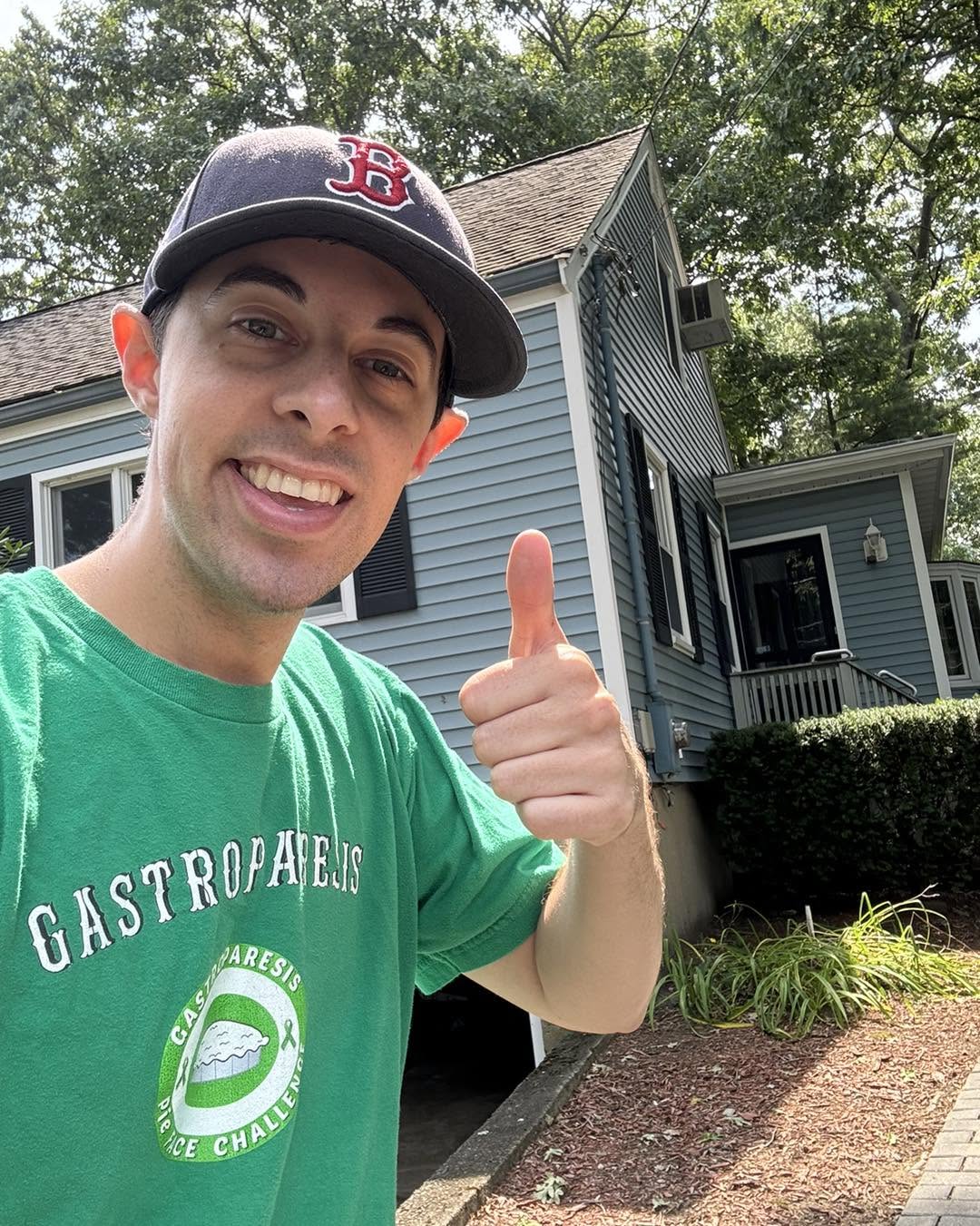 Andrew Belliveau giving a thumbs up wearing a Gastroparesis Pie Face Challenge t-shirt